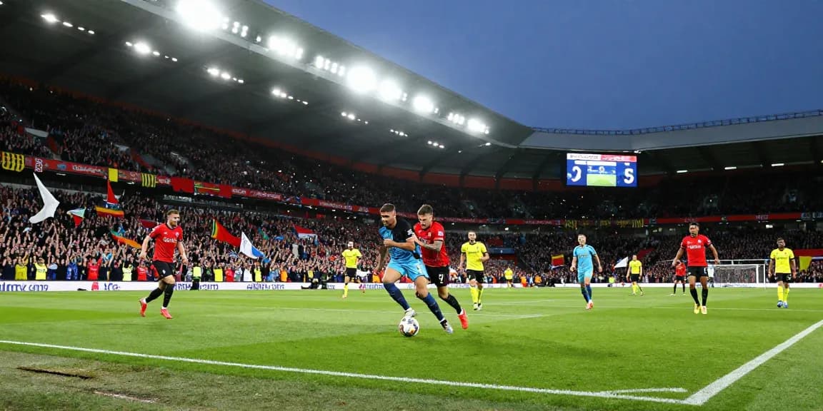 Exciting Premier League moment with bk8 branding, vibrant stadium atmosphere, and enthusiastic fans.