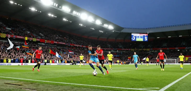 Exciting Premier League moment with bk8 branding, vibrant stadium atmosphere, and enthusiastic fans.